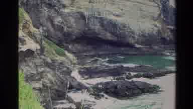 New Zealand (1982): Sign With Words And The Water From The Lake Hitting The Rocks