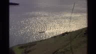 New Zealand (1982): A Lake Besides A Slope With A Boat On The Water