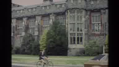 New Zealand (1982): Crosses And A Person Bicycling Next To A Stone Building Named