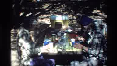 Big Sur California USA (1980): Three Men Eat Food At A Table And Then A Butterfly