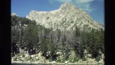 Grand Teton Wyoming USA (1980): A Mountainous Range Filled With Trees And Water At