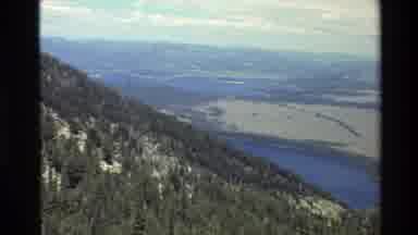 Grand Teton Wyoming USA (1980): Forested Mountain Slopes Down To A Body Of Water