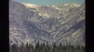 Grand Teton Wyoming USA (1980): Zooming In To Mountain Peak Forest Below Snow Caps