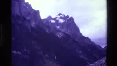Grand Teton Wyoming USA (1980): Mountain Peaks With Serene Cloud-Wisped Sky In The