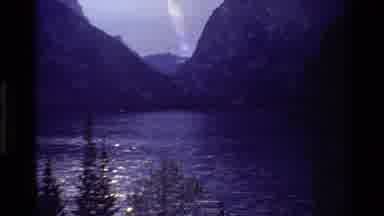 Grand Teton Wyoming USA (1980): Mountain With A Lake Followed By Fox Walking Along