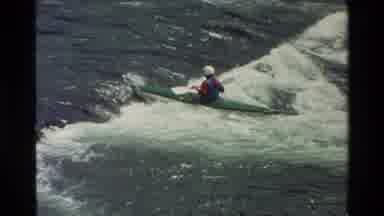 Grand Teton Wyoming USA (1980): Canoeist Riding Rapids Against The Tide