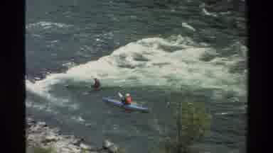 Grand Teton Wyoming USA (1980): Two To Four Kayakers On A River Being Recorded On