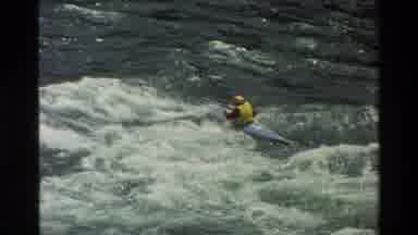 Grand Teton Wyoming USA (1980): Person In Life Jacket Kayaking Against A Very