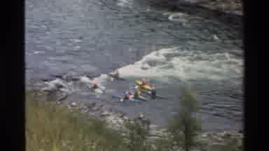 Grand Teton Wyoming USA (1980): Six People Rowing Against The Current In A River
