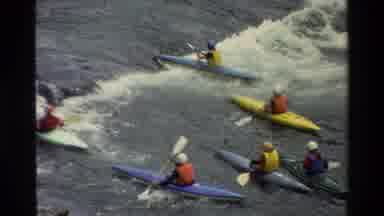 Grand Teton Wyoming USA (1980): People With Helmets In Kayaks On The Raging River