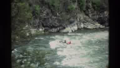 Grand Teton Wyoming USA (1980): Humans Raft With Paddle Sticks In Two Groups In A