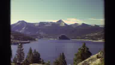 British Columbia USA (1981): Lake Surrounded By Tree Covered Mountains
