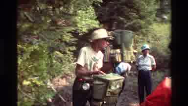 British Columbia USA (1981): Group Getting Ready For A Hike Putting On Backpack