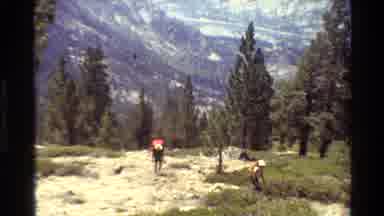British Columbia USA (1981): Two Male Backpackers Travel Up The Rocky Trail Of The