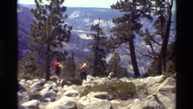 British Columbia USA (1981): Two People In Heavy Jackets Walking Through The