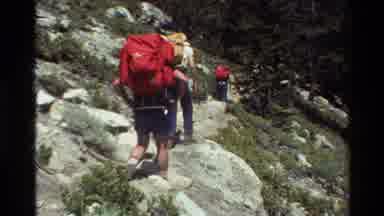 British Columbia USA (1981): Hikers With Red And Yellow Backpacks Walk On Rocky