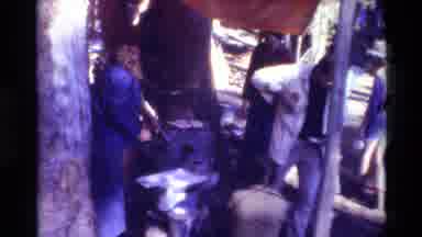 British Columbia USA (1981): People Cooking Burgers On Outdoor Grill On A Bright