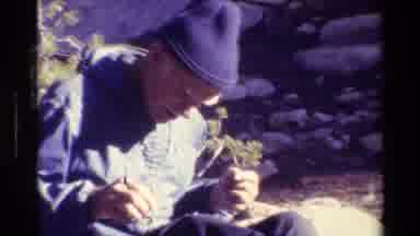 British Columbia USA (1981): Some Men In The Woods Sitting Apparently Reading