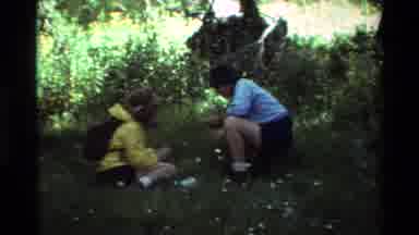 British Columbia USA (1981): Person Standing And Two People Observing A Grassy