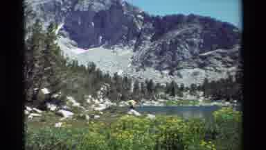 British Columbia USA (1981): Snow Covered Mountain Slope And Trees And Lake On