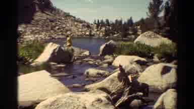 British Columbia USA (1981): A Person Is Walking Across Rocks That Are In A Water