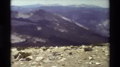 British Columbia USA (1981): Vista Of Mountains And Rocky Terrain With Scrub Plant
