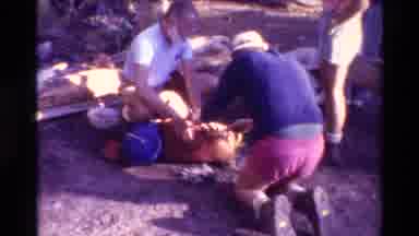 British Columbia USA (1981): Man Wearing Blue Shirt Ties Bundle For Hiking Trip