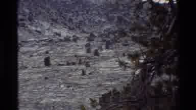 British Columbia USA (1981): Panning Footage Of Mountain Range Near Stream During