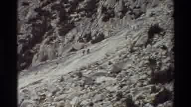 British Columbia USA (1981): Two People Walking Up A Somewhat Steep And Flat Rock