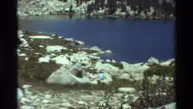 British Columbia USA (1981): Trees And Rocks Surrounding A Lake That Then Zooms In