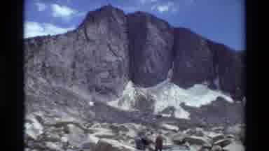 British Columbia USA (1981): Rock Outcrop Peaking Into The Sky With Two Men