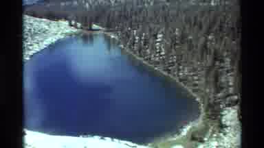 British Columbia USA (1981): Blue Body Water Nestled Between Snow Covered