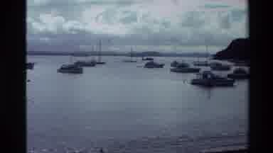 New Zealand (1981): Boats Sitting In Calm Bay Waters By Mountains On A Cloudy Day