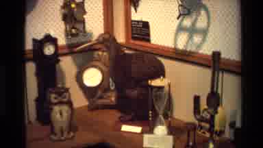 New Zealand (1981): A Wide Variety Of Unique Clocks Being Displayed Along A Wall