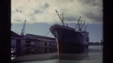 New Zealand (1981): Large Ship In Harbor As Well As Panning Out Footage Of City