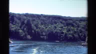 New Zealand-1981: Panning Across Mountains On A Shoreline During The Day With