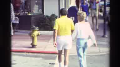 Carmel California USA (1982): Man With Yellow Shirt And White Shorts Holding Hands