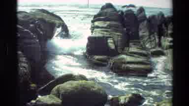 Carmel California USA (1982): A Large Ocean Wave Breaks Against A Beautiful Stony