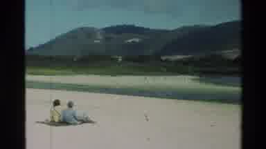 Carmel California USA (1982): Couple Sitting On The Beach Watches Waves And