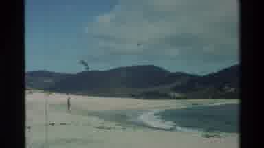 Carmel California USA (1982): A Person Stands On A White Sandy Beach Watching The