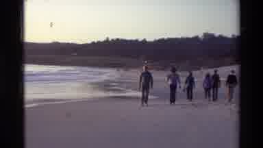 Carmel California USA (1982): Group Of People Walking On Beach And Where Water Has