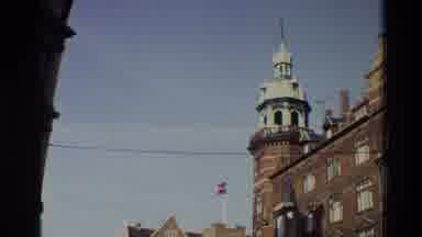 Denmark (1982): Flag On Top Of Building Blows In The Wind Against A Blue Sky