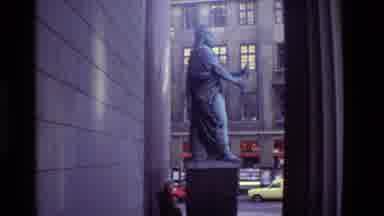 Denmark (1982): Statue Of A Bearded Man Holding An Object Near City Street And
