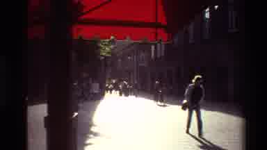 Denmark (1982): People Walking Around The City And There's A Blue Chair And A Red