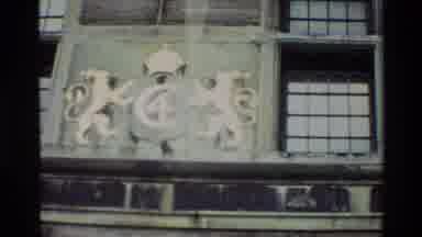 Denmark (1982): Two Guards Walking Stiffly On Sidewalk Under Building As Men