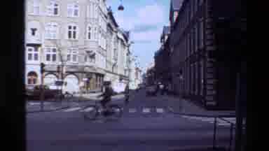 Denmark (1982): An Intersection In A City In Denmark With People And Tall