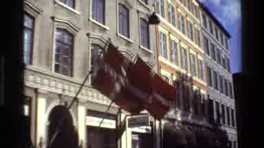 Denmark (1982): Two Denmark Flags Flutter In The Front Door Of A Building Where