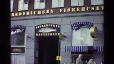 Denmark (1982): The Camera Zooms In To A Sign For A Restaurant With A Fish On It