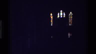 Denmark (1982): Light Shines Through Stained Glass Windows In Dark Building Zoom