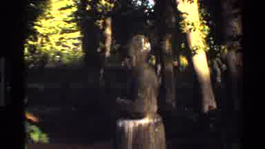 Denmark (1982): Wooded Area With Multiple Statues And Camera Focuses In On Statue